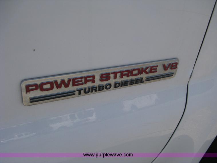 image for item B8141 2003 Ford F350 XL Super Duty flatbed pickup truck