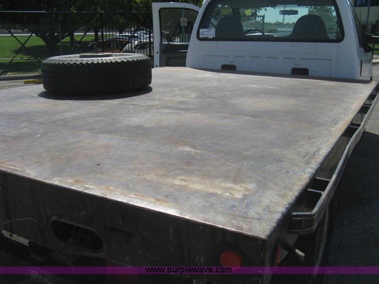 image for item B8141 2003 Ford F350 XL Super Duty flatbed pickup truck