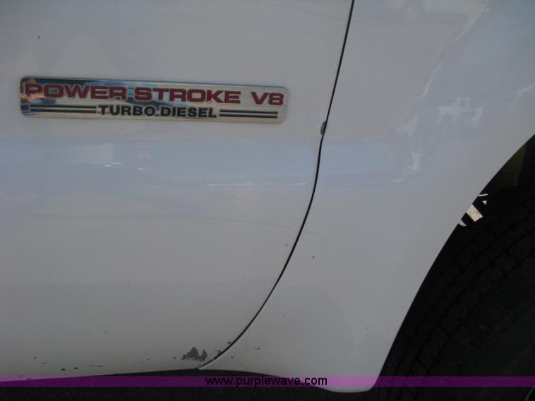 image for item B8141 2003 Ford F350 XL Super Duty flatbed pickup truck