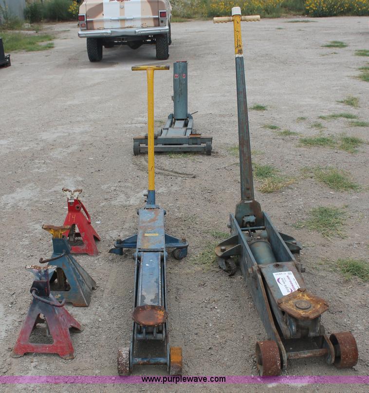 image for item C2832 Two floor jacks and three jack stands