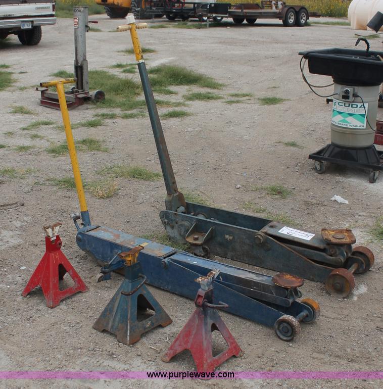image for item C2832 Two floor jacks and three jack stands