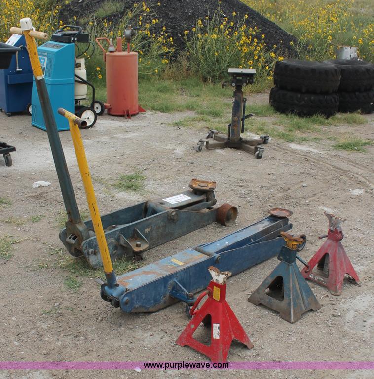 image for item C2832 Two floor jacks and three jack stands
