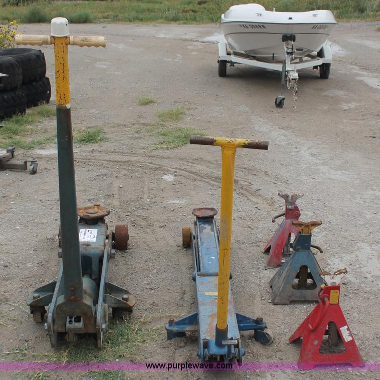 image for item C2832 Two floor jacks and three jack stands