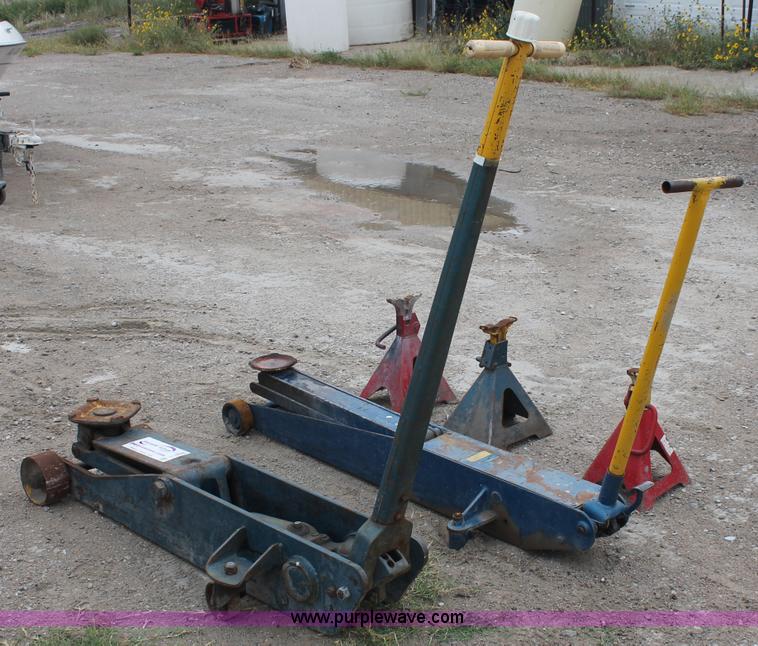 image for item C2832 Two floor jacks and three jack stands