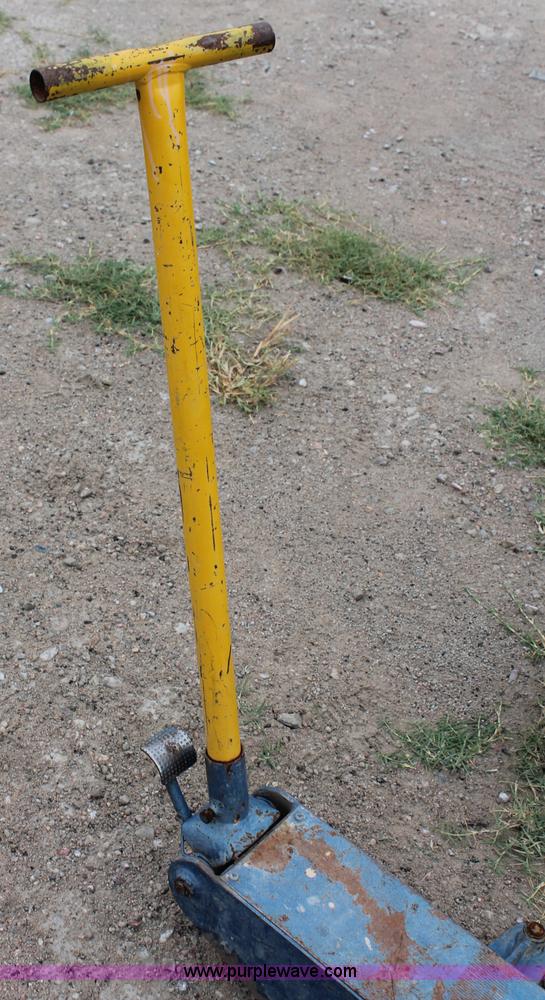 image for item C2832 Two floor jacks and three jack stands