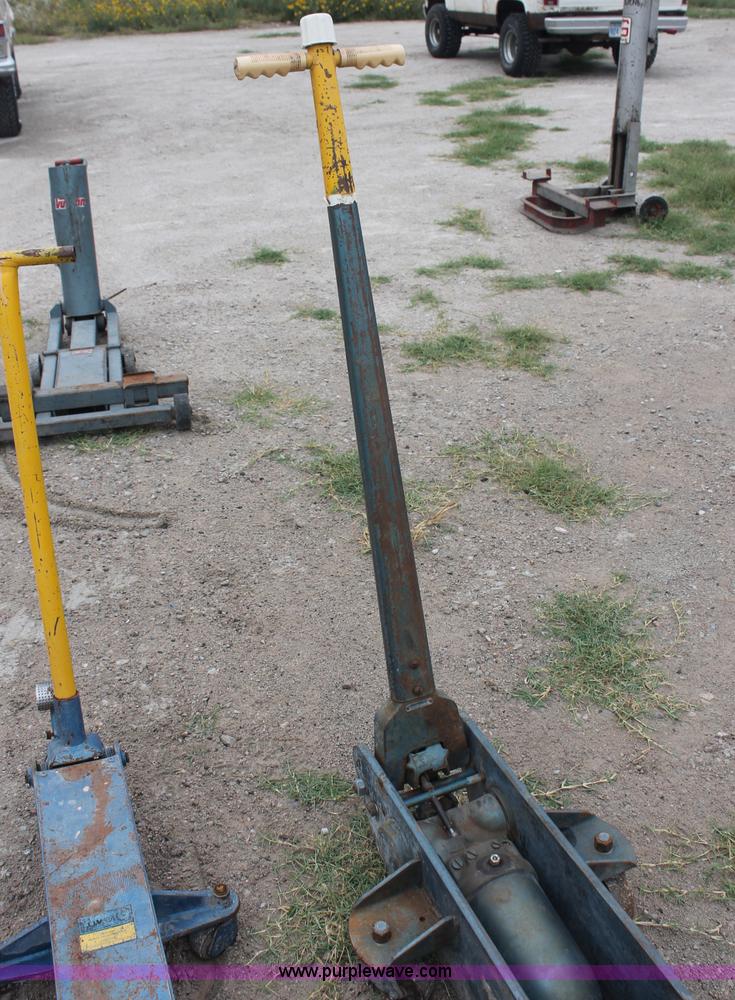 image for item C2832 Two floor jacks and three jack stands