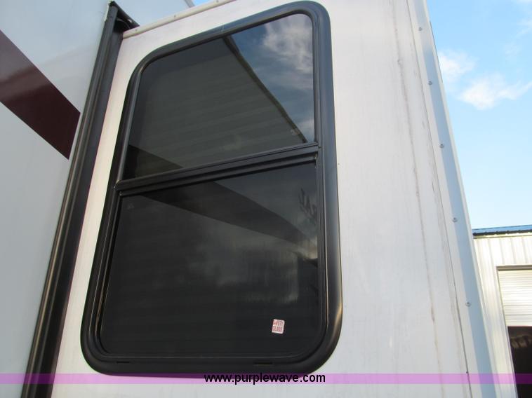 image for item F4582 2011 Coachman 310RLTS fifth wheel camper