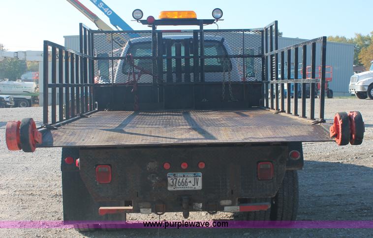 image for item C2911 2007 Ford F650 flatbed rollback truck