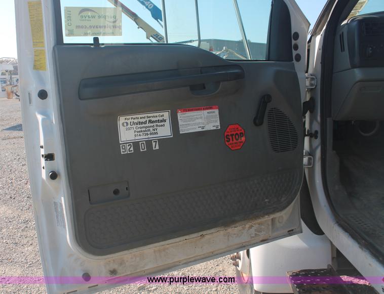 image for item C2911 2007 Ford F650 flatbed rollback truck