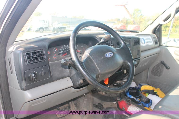 image for item C2911 2007 Ford F650 flatbed rollback truck