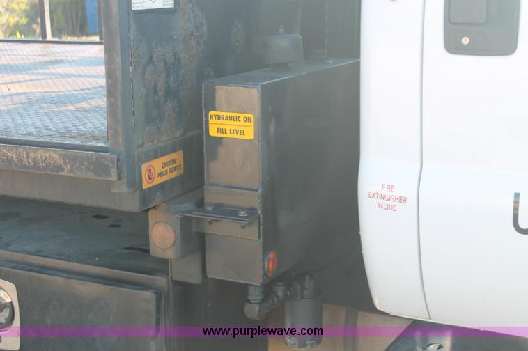image for item C2911 2007 Ford F650 flatbed rollback truck