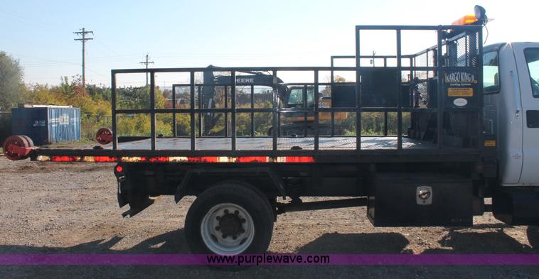 image for item C2911 2007 Ford F650 flatbed rollback truck