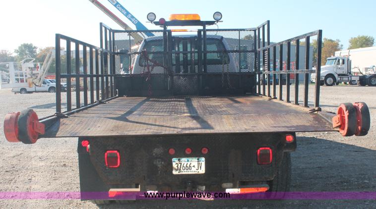 image for item C2911 2007 Ford F650 flatbed rollback truck