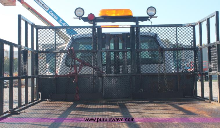 image for item C2911 2007 Ford F650 flatbed rollback truck
