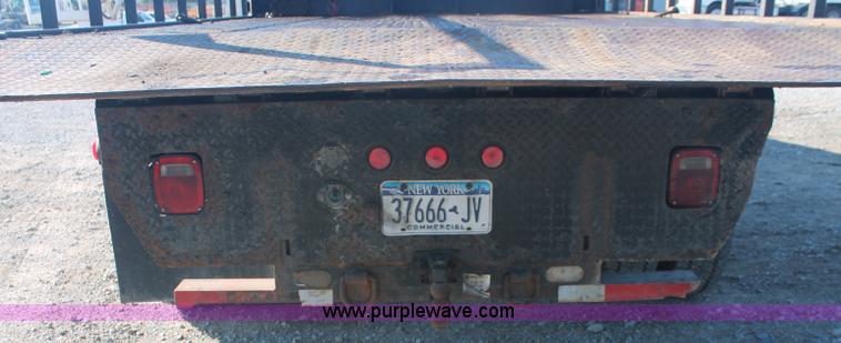 image for item C2911 2007 Ford F650 flatbed rollback truck