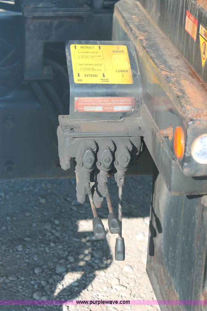 image for item C2911 2007 Ford F650 flatbed rollback truck