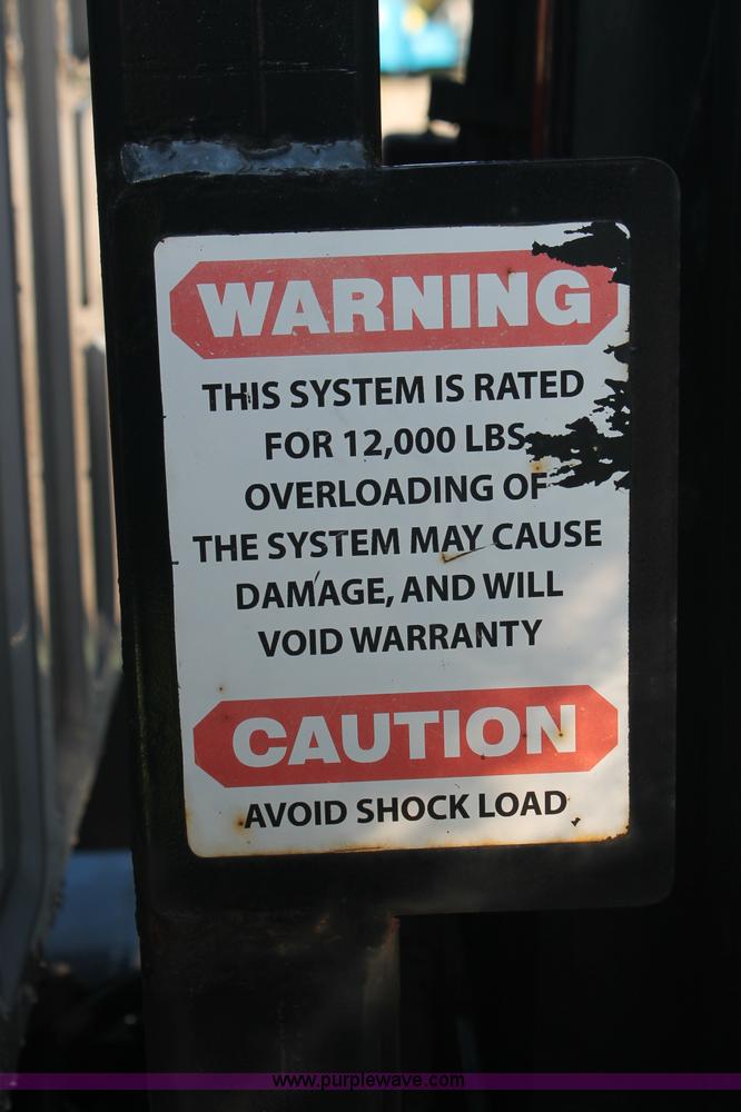 image for item C2911 2007 Ford F650 flatbed rollback truck