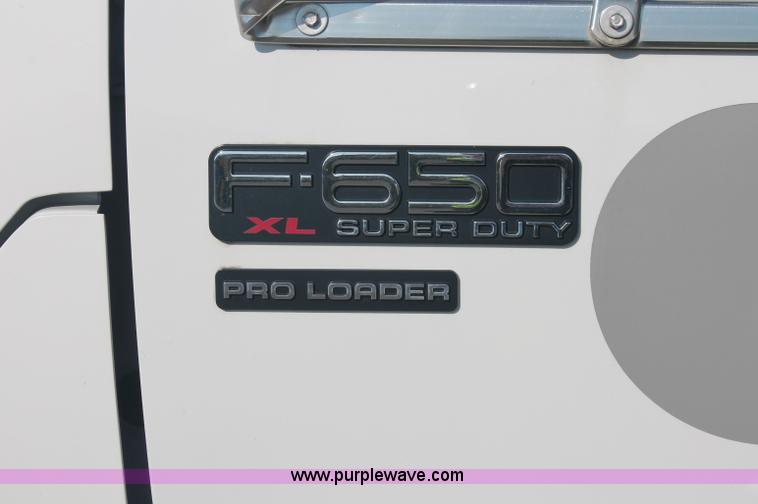 image for item C2911 2007 Ford F650 flatbed rollback truck