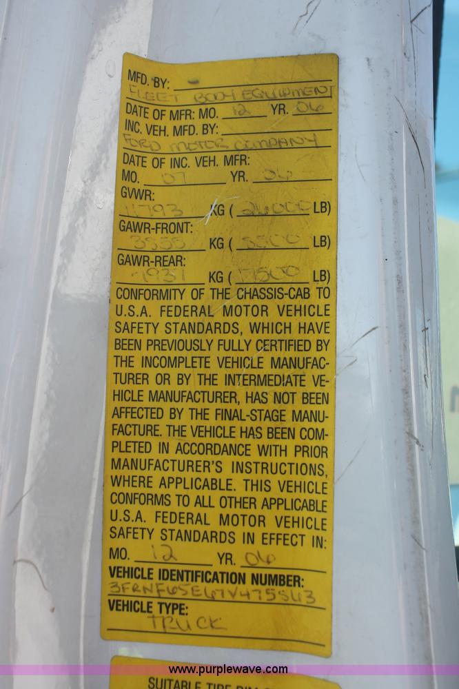 image for item C2911 2007 Ford F650 flatbed rollback truck