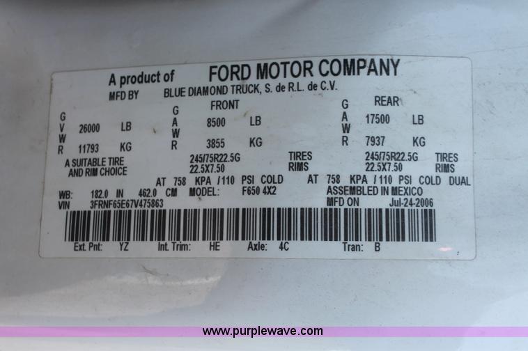 image for item C2911 2007 Ford F650 flatbed rollback truck