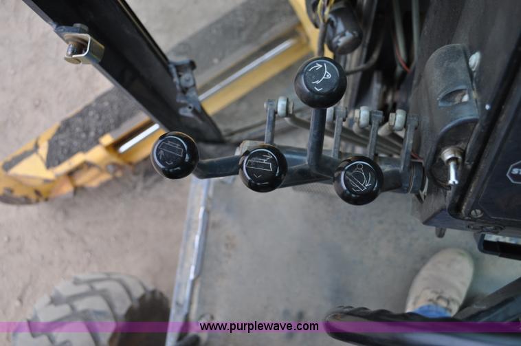 image for item C3027 2004 John Deere 772CH II motor grader