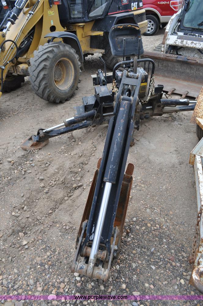 image for item C3033 New Holland B-104 backhoe skid steer attachment