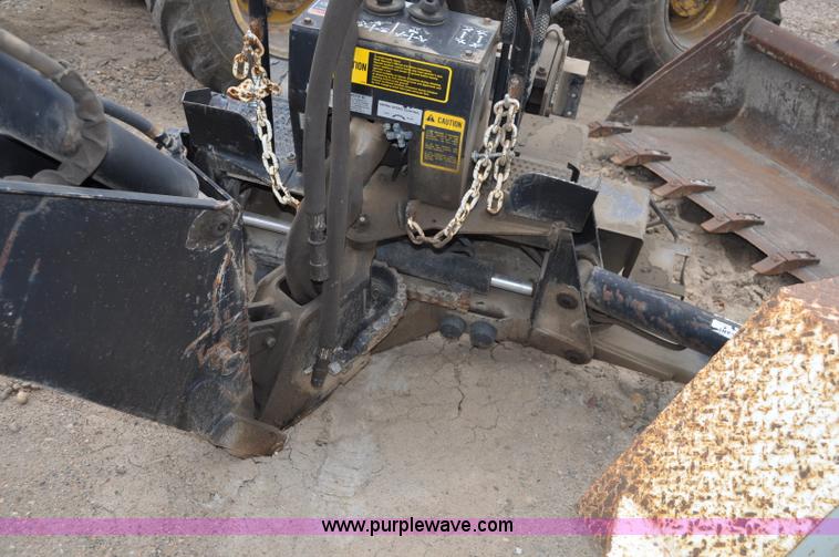 image for item C3033 New Holland B-104 backhoe skid steer attachment