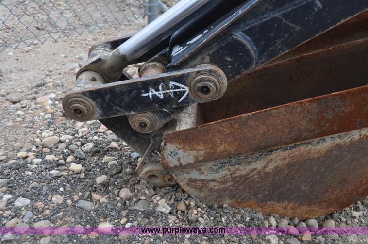 image for item C3033 New Holland B-104 backhoe skid steer attachment