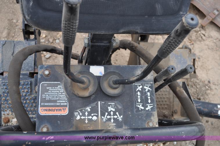 image for item C3033 New Holland B-104 backhoe skid steer attachment