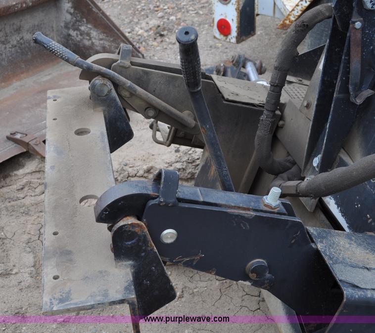 image for item C3033 New Holland B-104 backhoe skid steer attachment