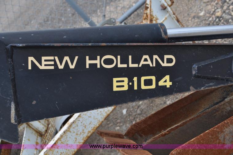 image for item C3033 New Holland B-104 backhoe skid steer attachment