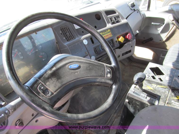 image for item F4605 1997 Ford Louisville 113 semi truck cab and chassis