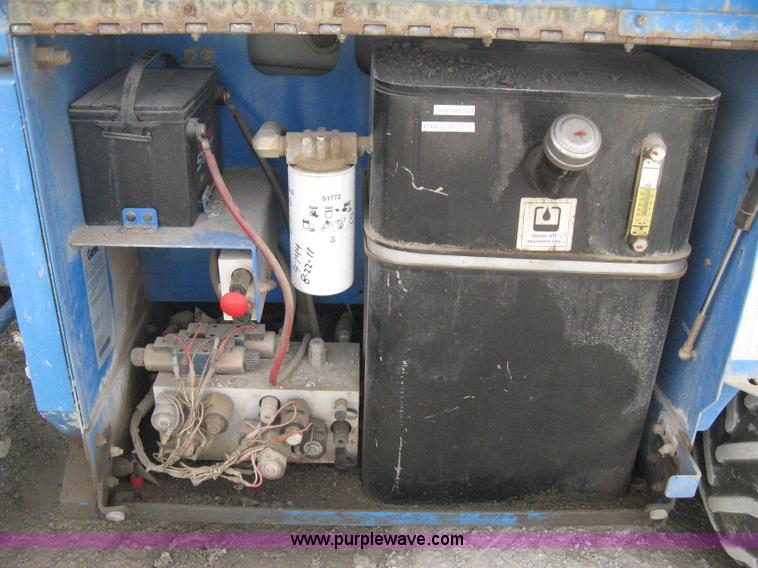 image for item B8298 2001 Genie GS-3268RT rough terrain scissor lift