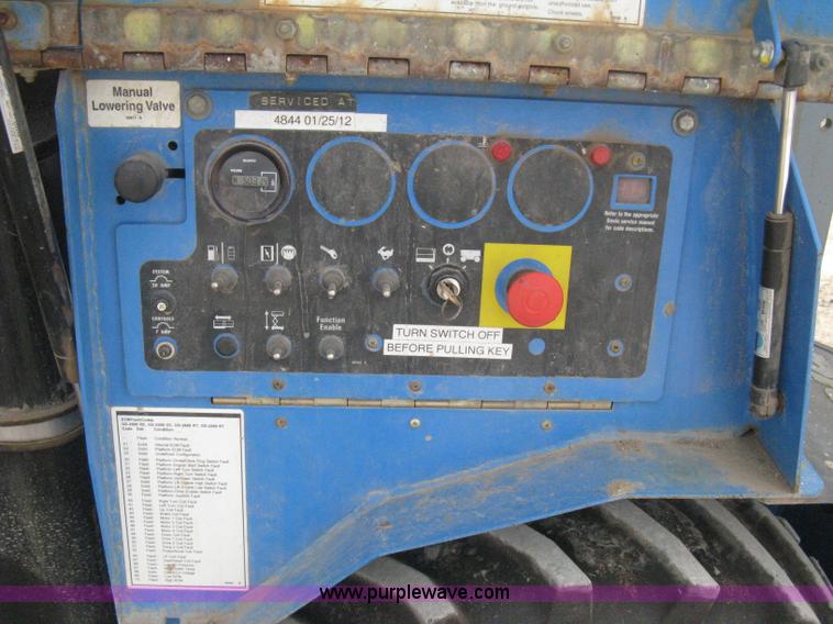 image for item B8298 2001 Genie GS-3268RT rough terrain scissor lift