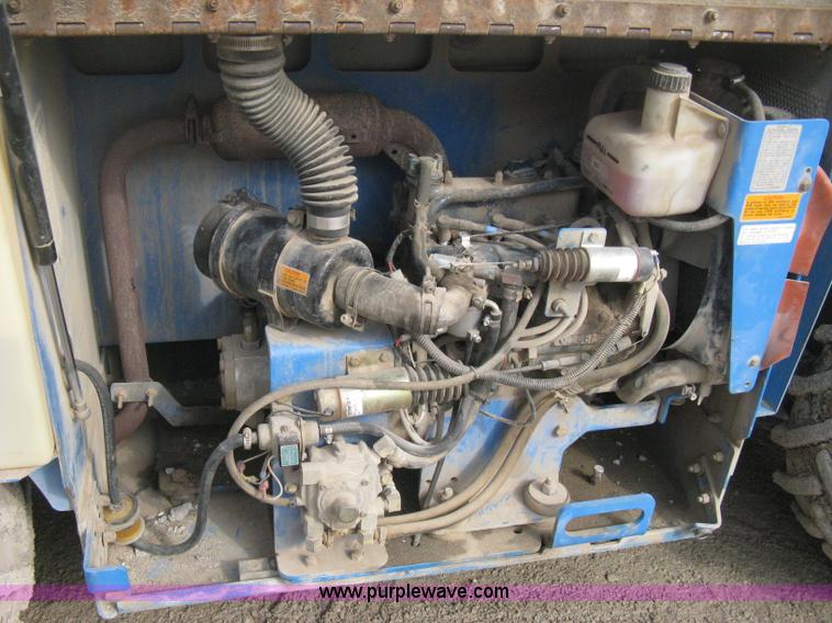 image for item B8298 2001 Genie GS-3268RT rough terrain scissor lift