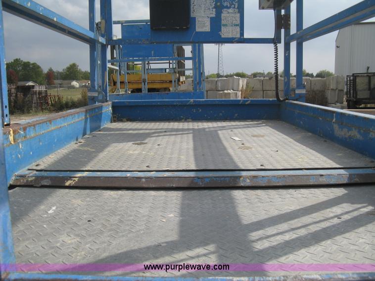 image for item B8298 2001 Genie GS-3268RT rough terrain scissor lift