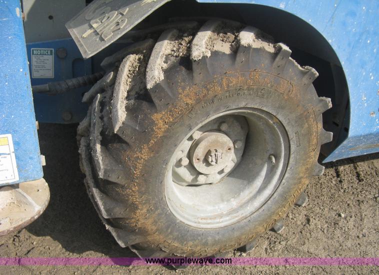 image for item B8298 2001 Genie GS-3268RT rough terrain scissor lift