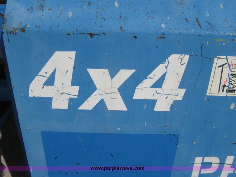 image for item B8299 2003 Genie GS-3268RT rough terrain scissor lift