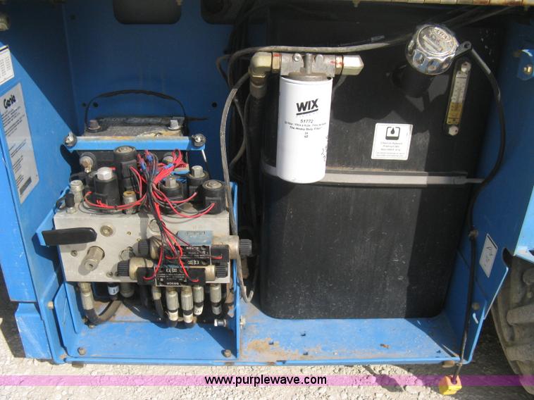 image for item B8299 2003 Genie GS-3268RT rough terrain scissor lift