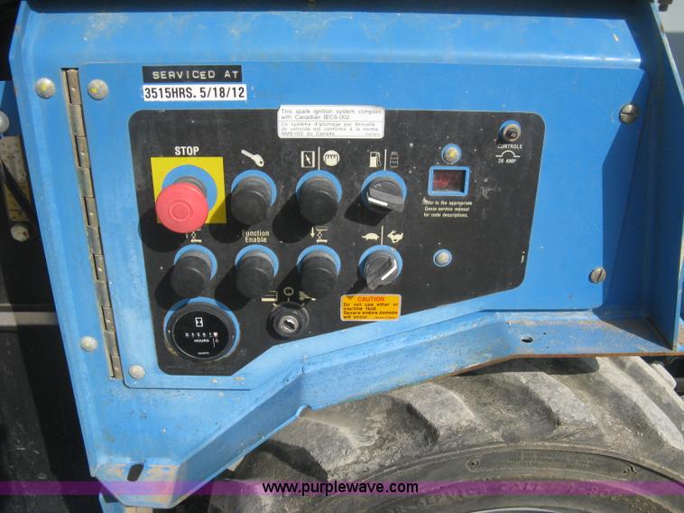 image for item B8299 2003 Genie GS-3268RT rough terrain scissor lift