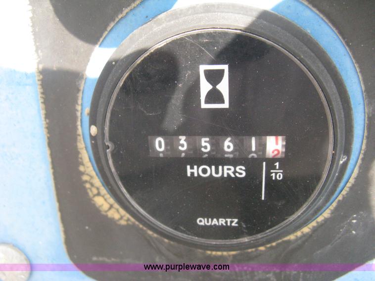 image for item B8299 2003 Genie GS-3268RT rough terrain scissor lift