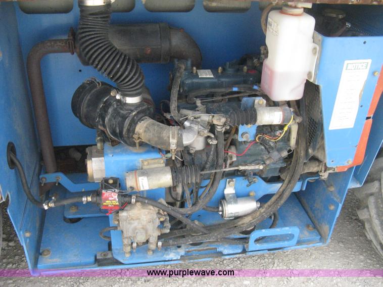 image for item B8299 2003 Genie GS-3268RT rough terrain scissor lift