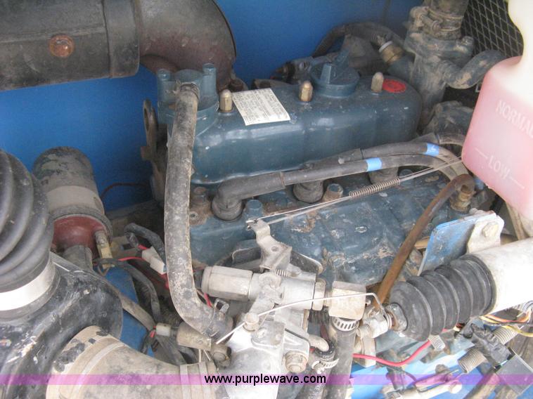 image for item B8299 2003 Genie GS-3268RT rough terrain scissor lift