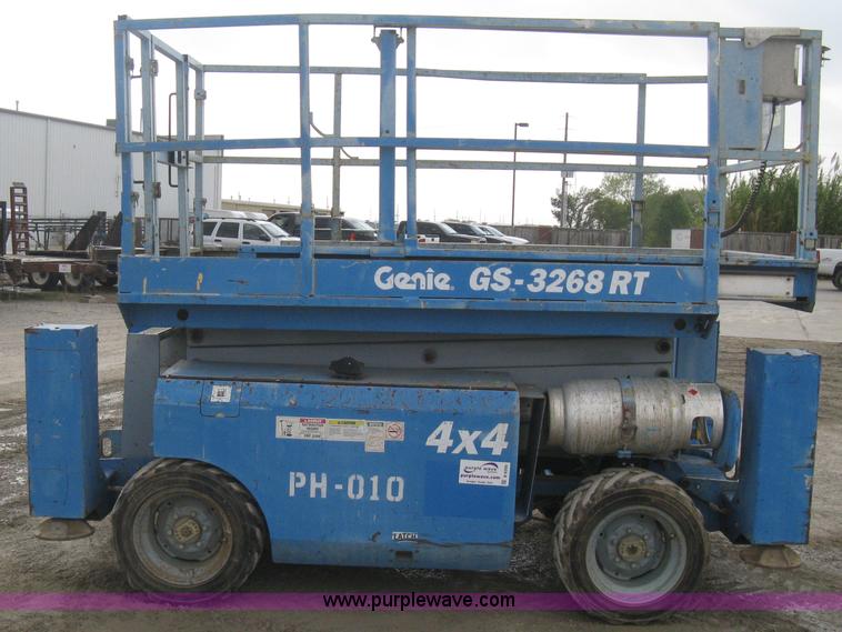 image for item B8300 2003 Genie GS-3268RT rough terrain scissor lift