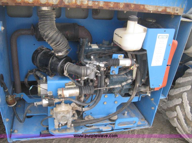 image for item B8300 2003 Genie GS-3268RT rough terrain scissor lift