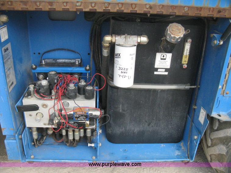 image for item B8300 2003 Genie GS-3268RT rough terrain scissor lift