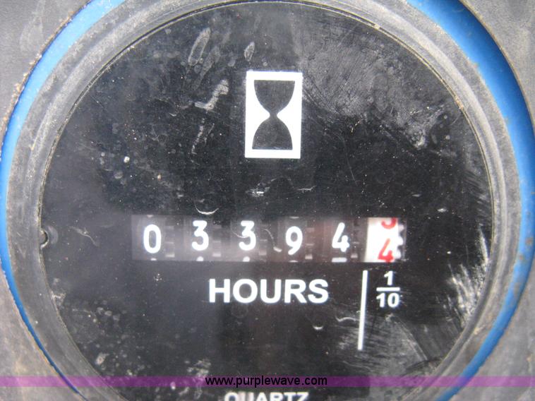 image for item B8300 2003 Genie GS-3268RT rough terrain scissor lift