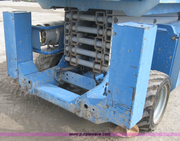 image for item B8300 2003 Genie GS-3268RT rough terrain scissor lift