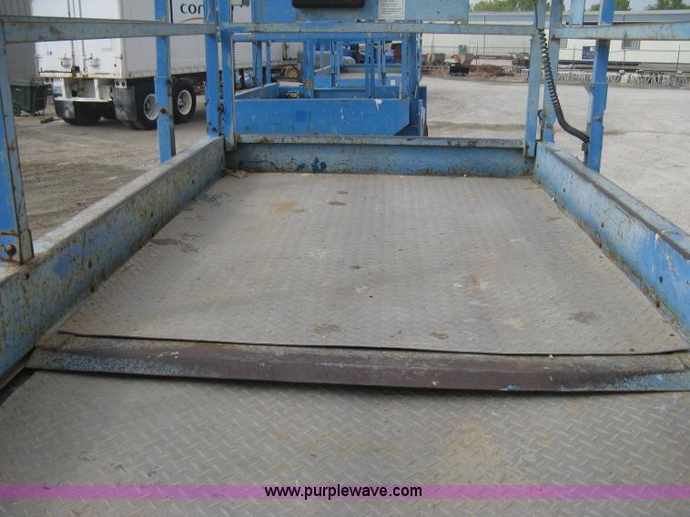 image for item B8300 2003 Genie GS-3268RT rough terrain scissor lift