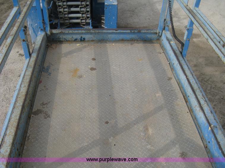 image for item B8300 2003 Genie GS-3268RT rough terrain scissor lift